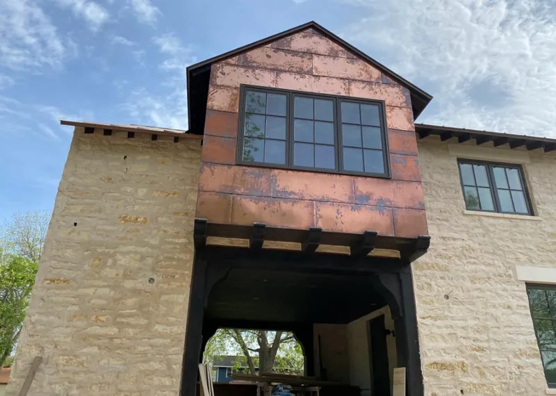 Copper metal panel facade on a stone building for Metal Roof Coating in Tualatin