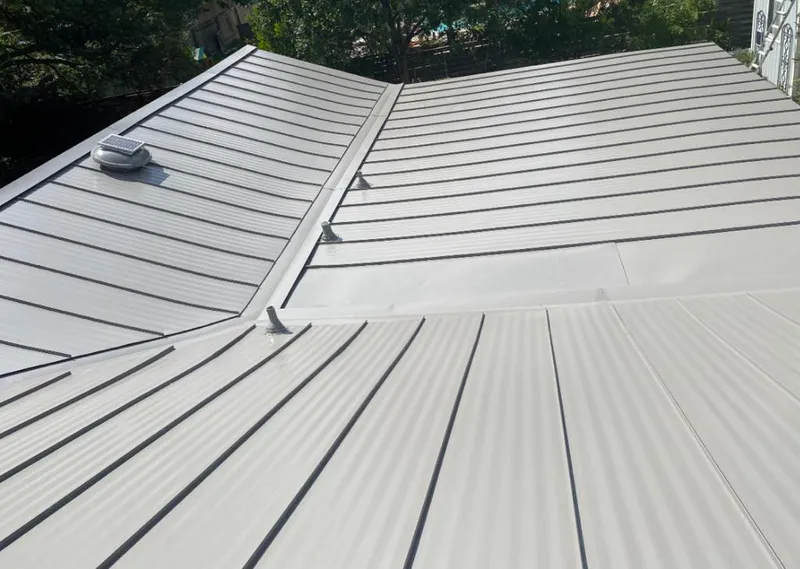 Solar attic fan installed on a metal roof for Roof Ventilation in Tualatin